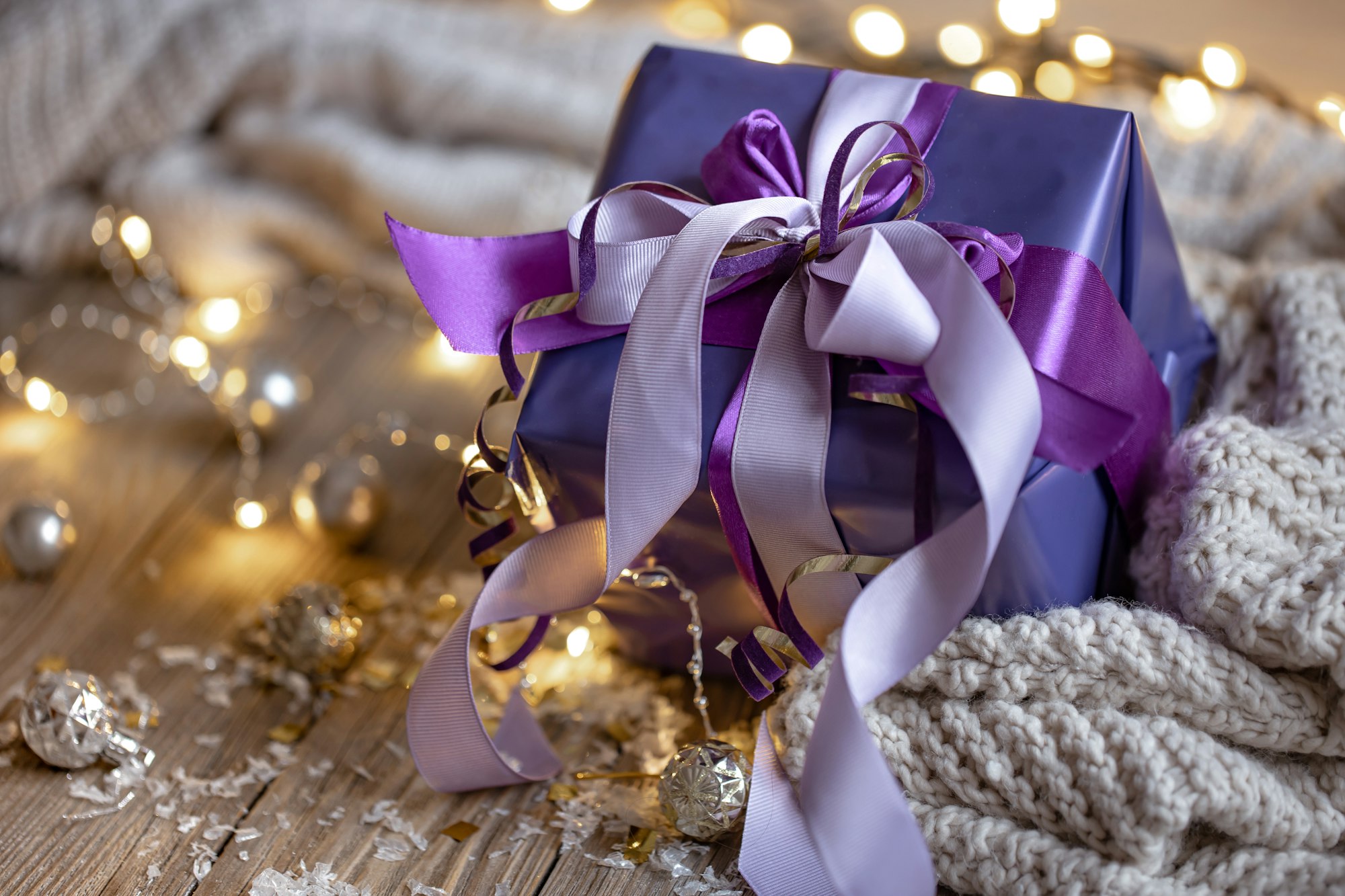 Close up of gift box on blurred background with bokeh.